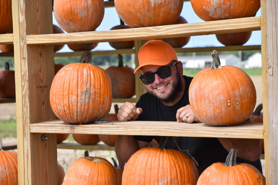 Watewrdrinker Family Farm owner Marc Weiss
poses inside his farm's pumpkin house.